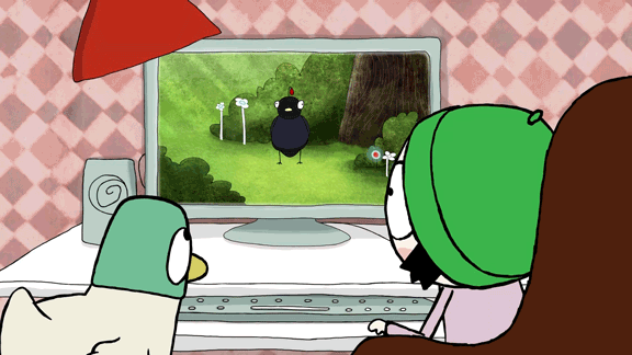 Sarah and Duck looking at a bird on the computer