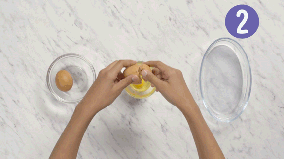 Hands breaking and whisking eggs